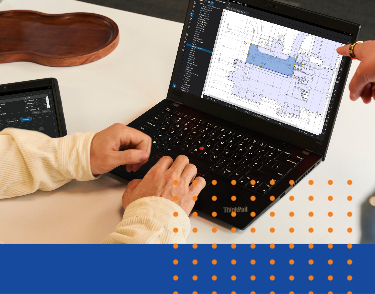 Two people on a laptop using Bluebeam software